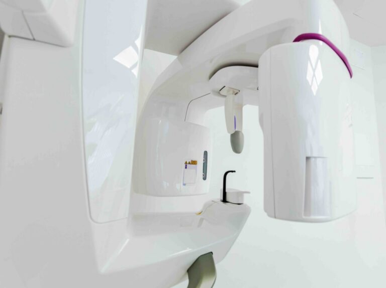 Cone beam CT scanner in a dental imaging room
